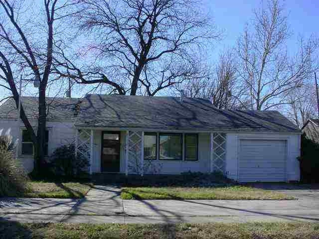 2513 35th Street Lubbock, TX 79413 - Photo 1 of 1 a front view of a house with a garden