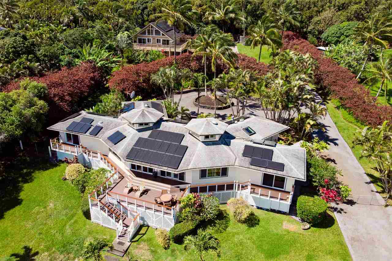 an aerial view of a house with a garden