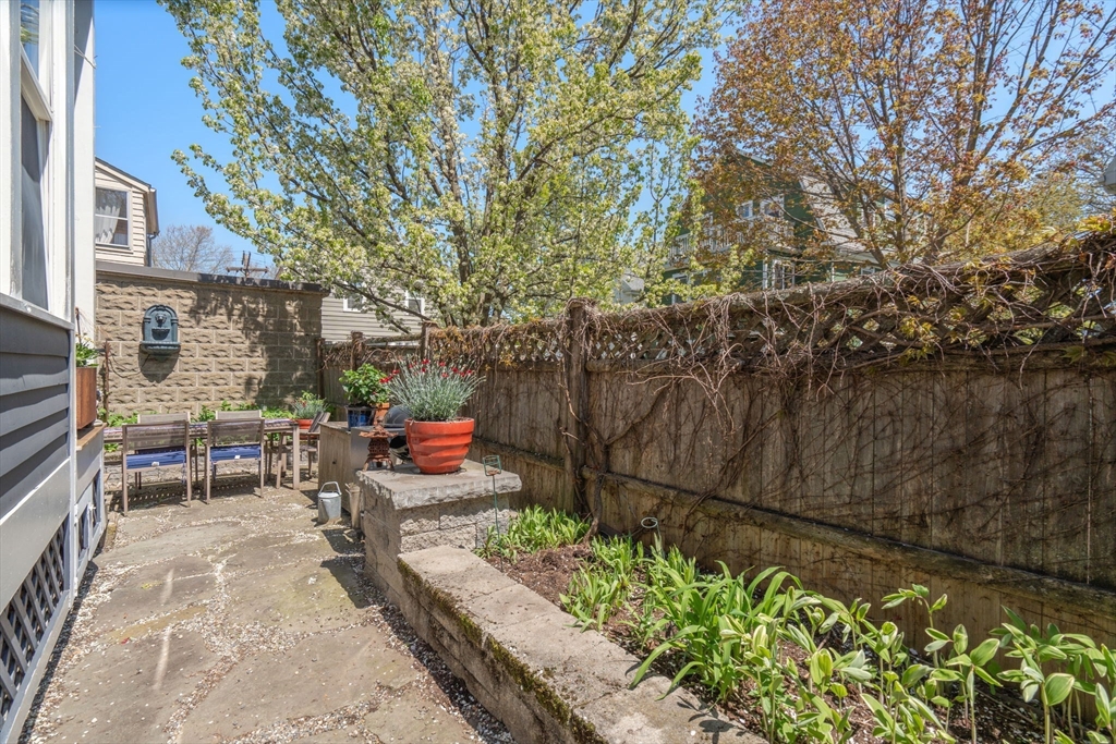 45 Springfield Street, Unit 1 Belmont, MA 02478 - Photo 22 of 27 an outdoor view of garden with patio