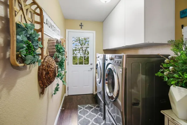 a view of a hallway with washer and dryer