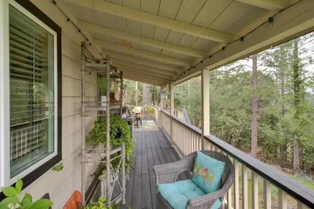 a view of a balcony with chairs
