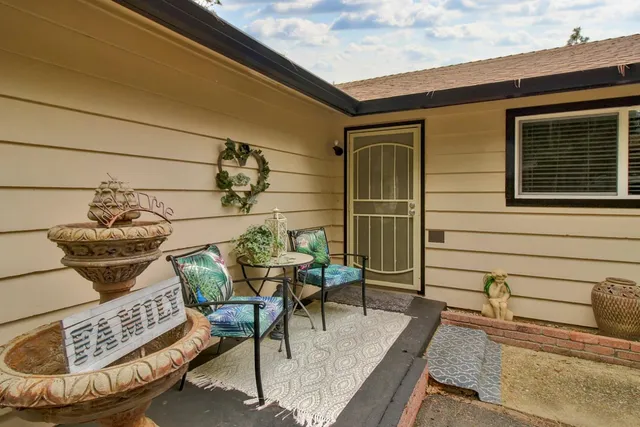 a view of a chairs and tables in the patio