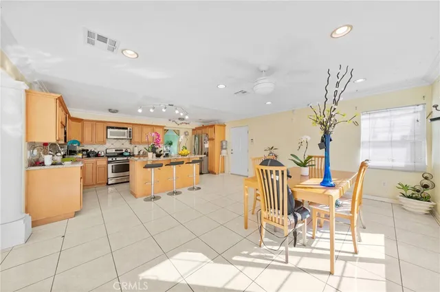 a kitchen with granite countertop a sink stainless steel appliances and cabinets