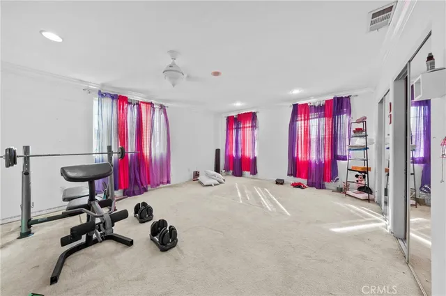 a bed room with a bed and a window