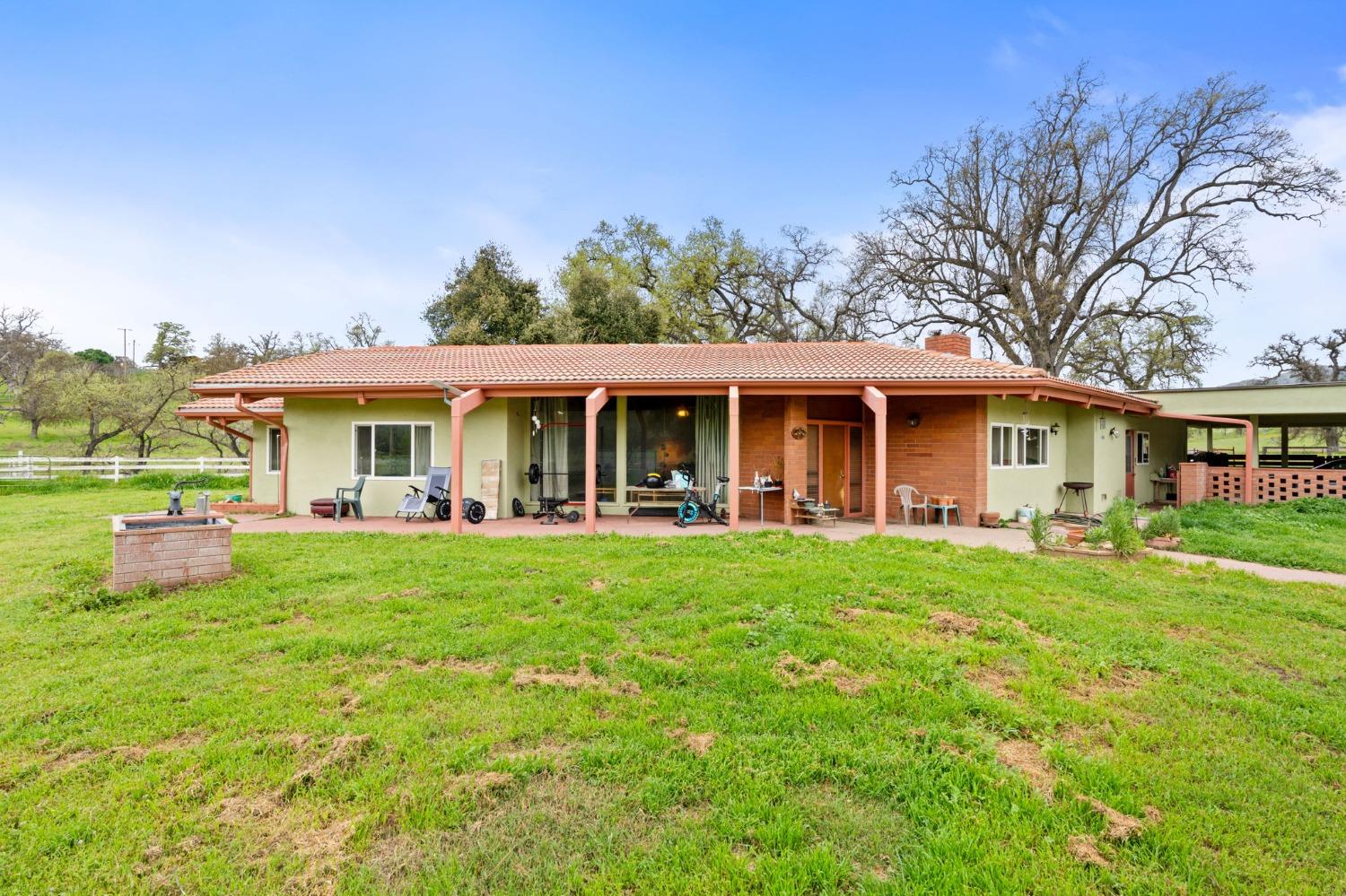 53660 Drive 152 Orosi, CA 93647 - Photo 27 of 48 front view of a house with a patio yard and balcony