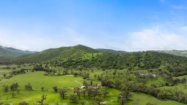 a view of a town with mountains in the background