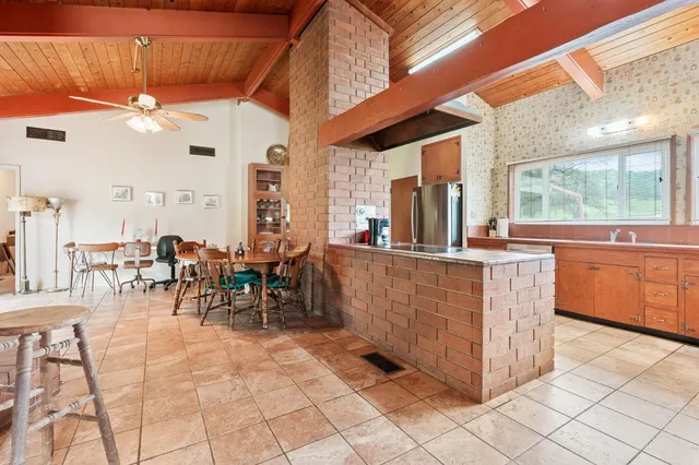 a view of an outside dining space with furniture
