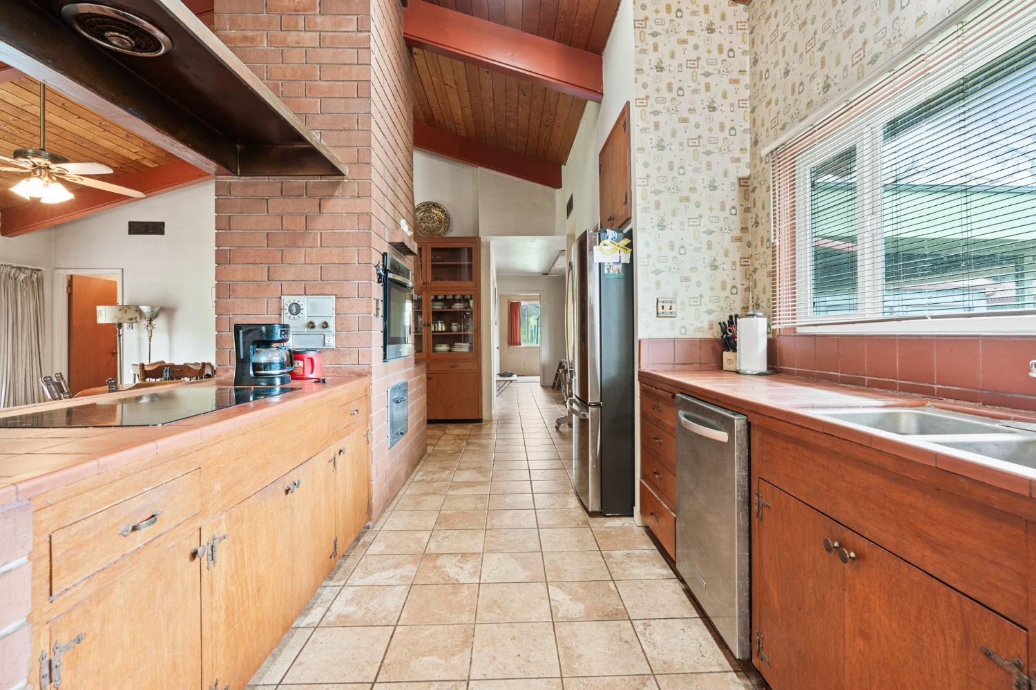 53660 Drive 152 Orosi, CA 93647 - Photo 35 of 48 a large white kitchen with cabinets