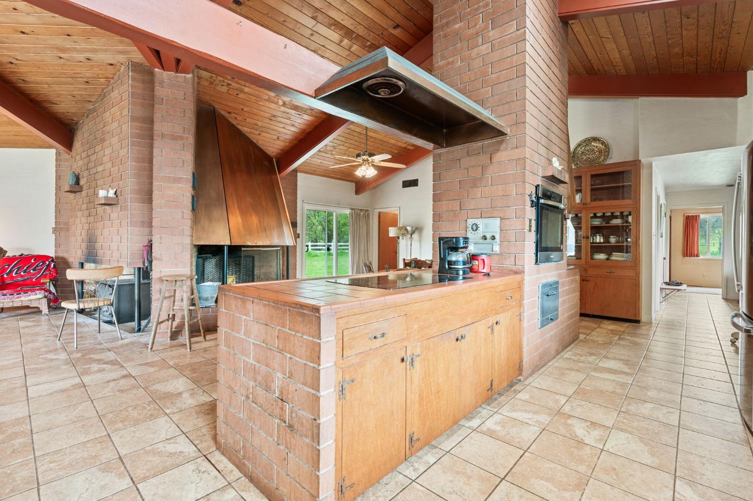 53660 Drive 152 Orosi, CA 93647 - Photo 36 of 48 a large white kitchen with a large window and cabinets