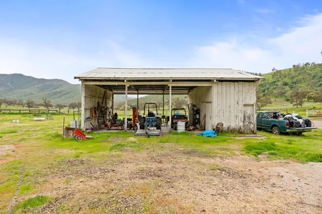 a view of a chairs and table in a patio