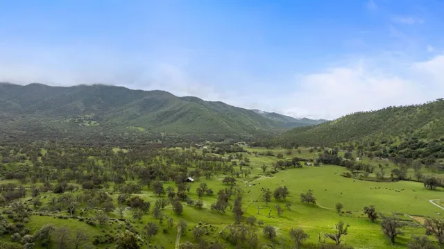 a view of a town with mountains in the background