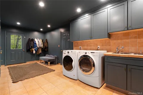 a bathroom with a sink toilet and mirror
