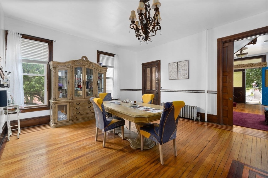 311 Elm Street Woonsocket, RI 02895 - Photo 17 of 29 a view of a dining room with furniture window and wooden floor