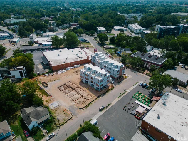 an aerial view of a city with lots of residential buildings