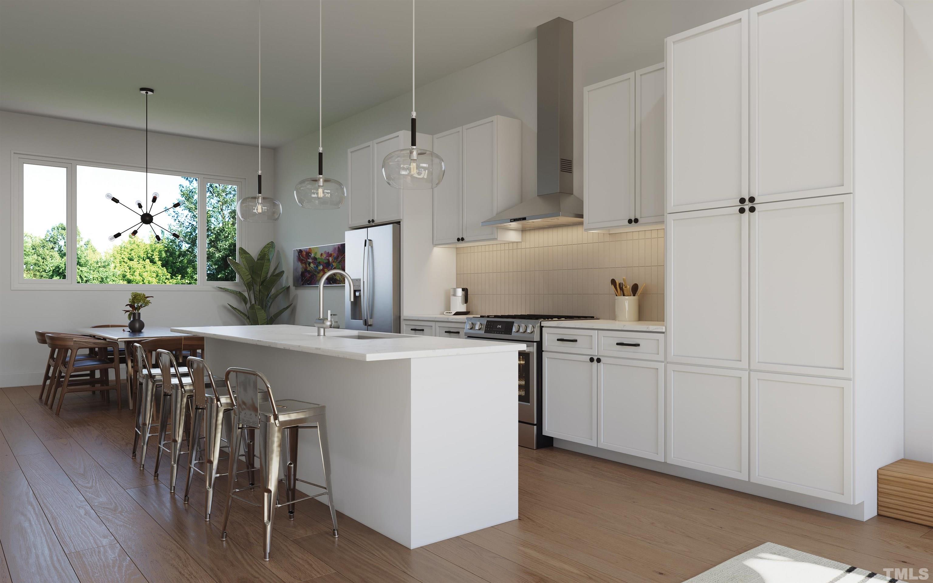 3007 Corbell Road Durham, NC 27701 - Photo 18 of 30 a kitchen with cabinets and wooden floor