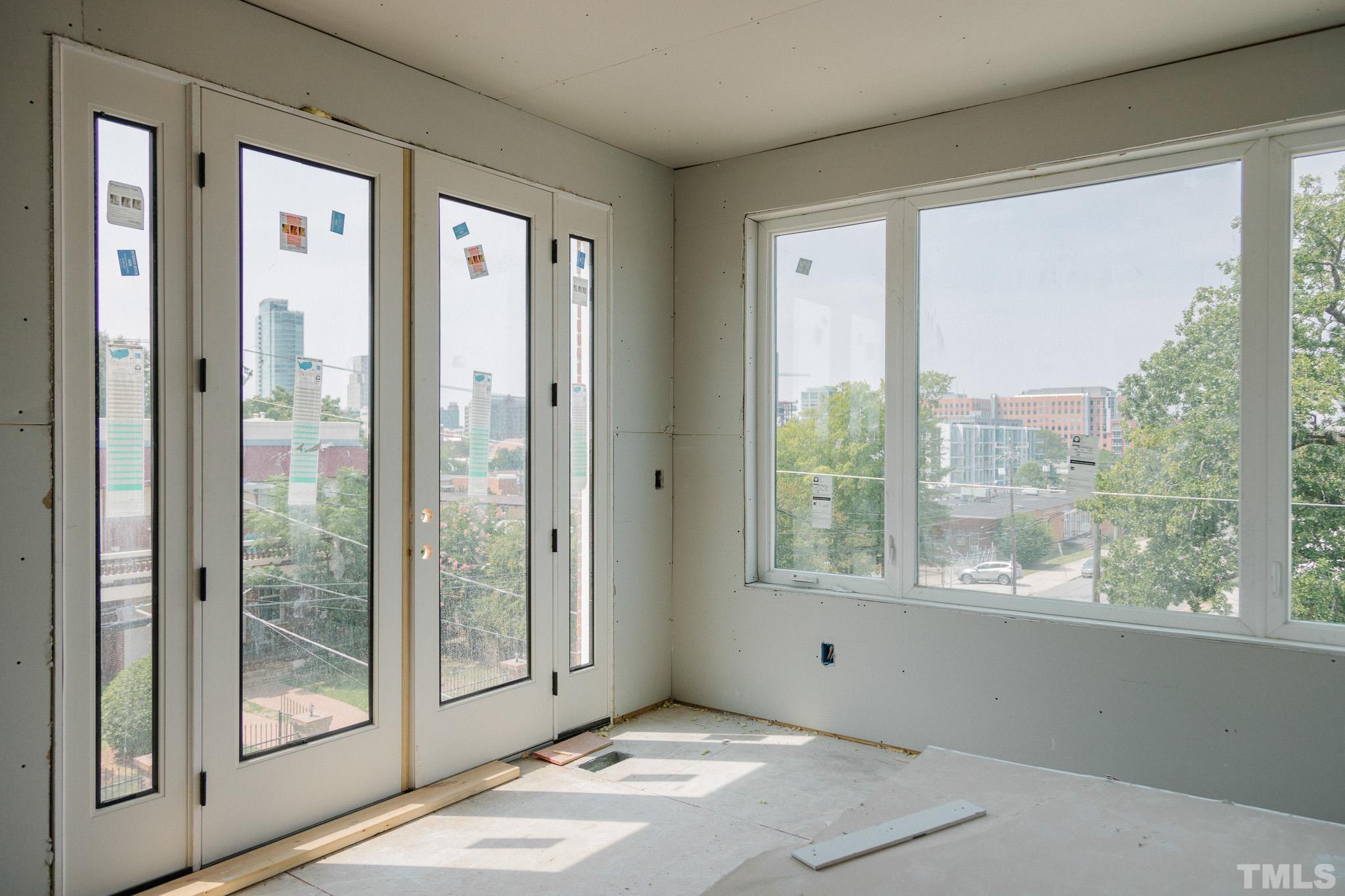 3007 Corbell Road Durham, NC 27701 - Photo 5 of 30 a view of an empty room with glass windows