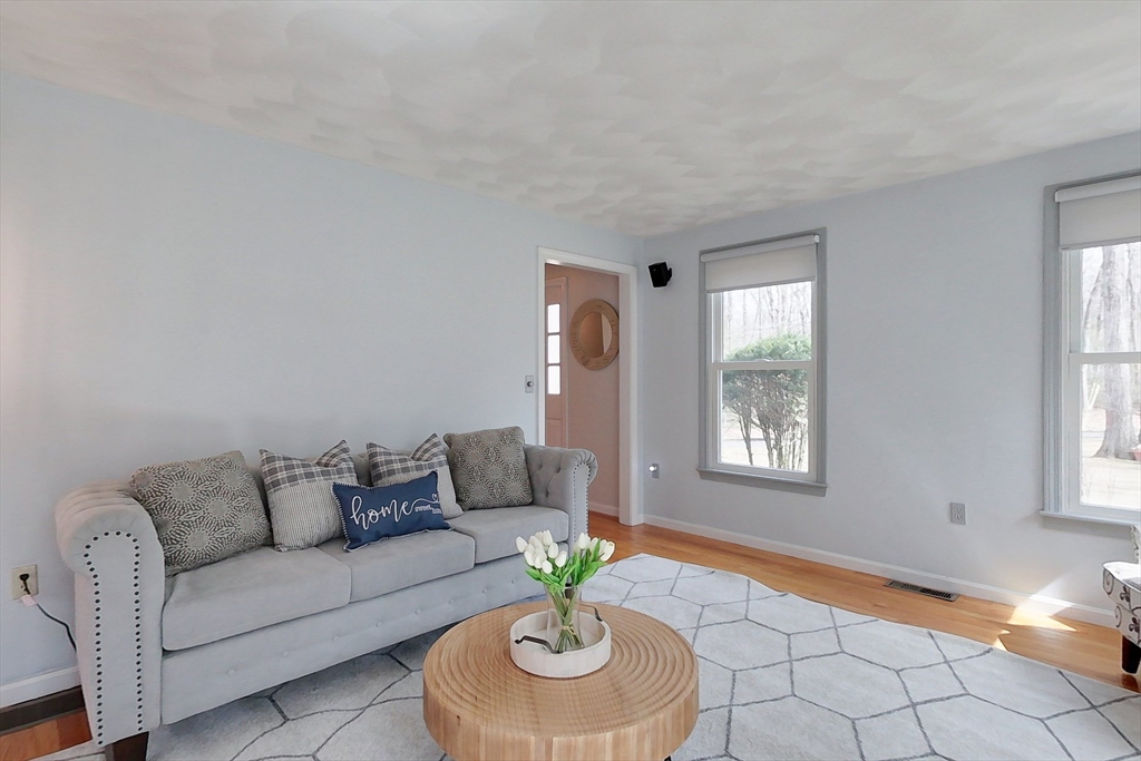 4 Wilderness Way Pepperell, MA 01463 - Photo 13 of 42 a living room with furniture and a window
