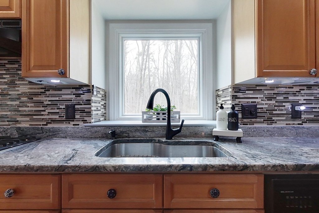 4 Wilderness Way Pepperell, MA 01463 - Photo 3 of 42 a kitchen with granite countertop a sink and a stove