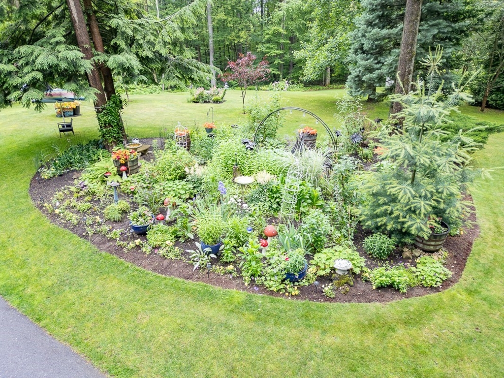 4 Wilderness Way Pepperell, MA 01463 - Photo 34 of 42 a view of a garden with a fountain