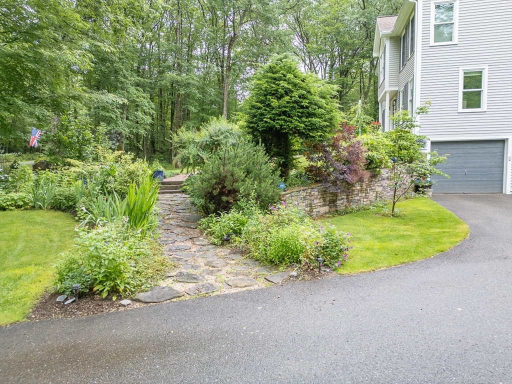 4 Wilderness Way Pepperell, MA 01463 - Photo 35 of 42 a view of a swimming pool with a garden