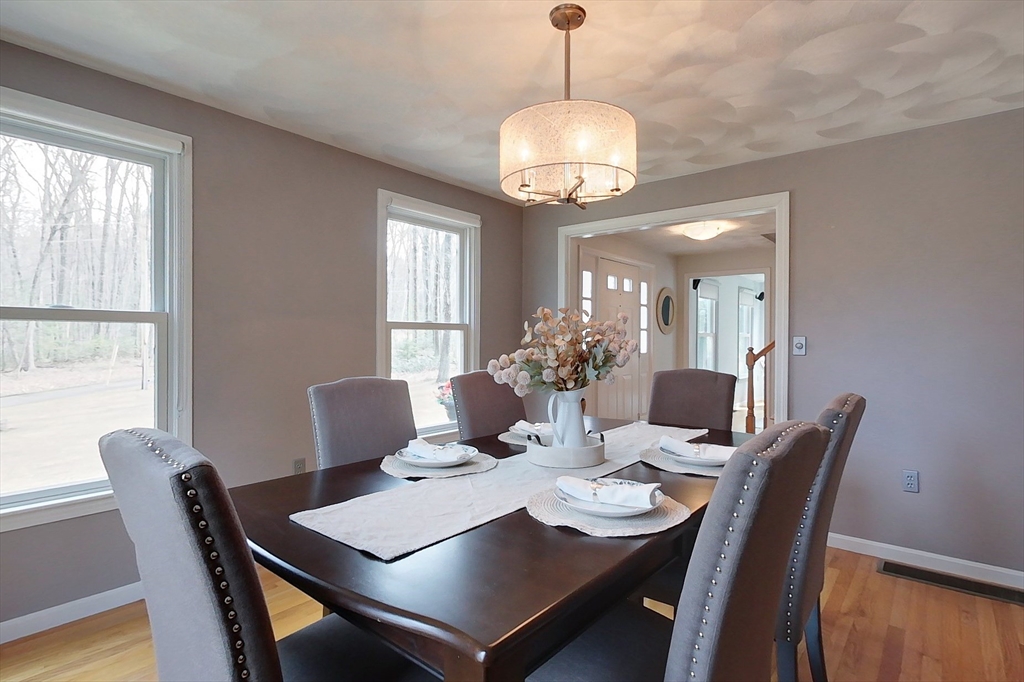 4 Wilderness Way Pepperell, MA 01463 - Photo 10 of 42 a view of a dining room with furniture window and wooden floor