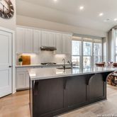 a kitchen with a sink cabinets and window