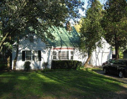 1253 High Ridge Road Stamford, CT 06903 - Photo 1 of 1 a front view of a house with a garden
