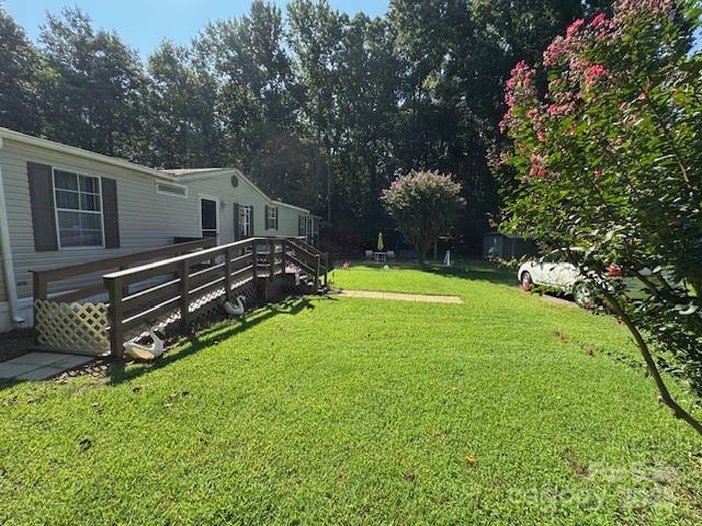 a view of a house with a backyard