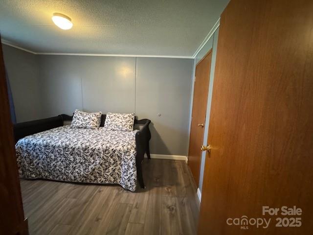 1761 Finch Farm Road, Unit 4 Trinity, NC 27370 - Photo 16 of 37 a bedroom with a bed and a table in it