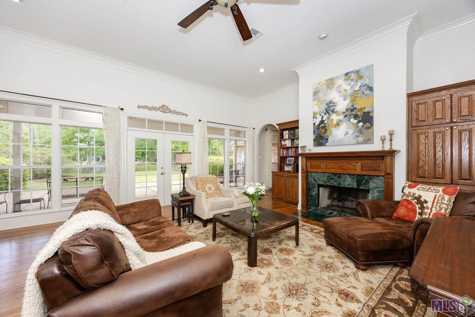 13407 North Amiss Road Baton Rouge, LA 70810 - Photo 14 of 39 Living Room Has Views of Backyard and Opens onto the Patio