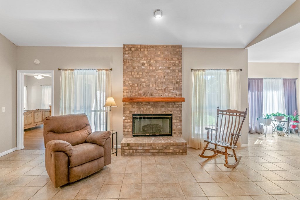 225 Los Cedros Loop Kerrville, TX 78028 - Photo 15 of 27 a living room with furniture and a fireplace