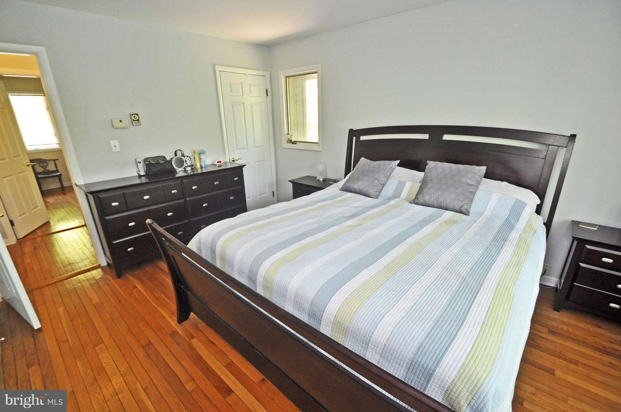 4701 Teen Barnes Road Frederick, MD 21703 - Photo 14 of 30 Master bedroom w/ stained wood flooring