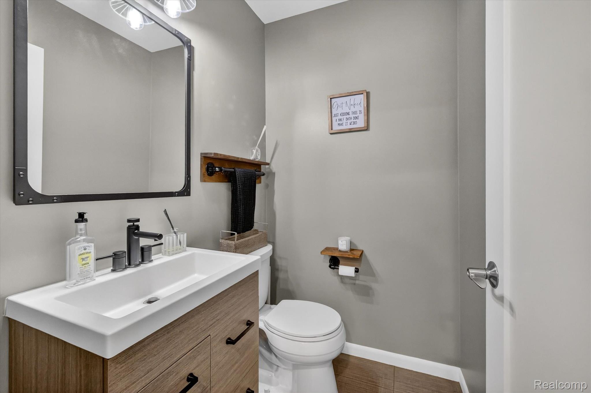 2264 Crane Road Fenton, MI 48430 - Photo 42 of 55 Half bathroom with vanity and baseboards