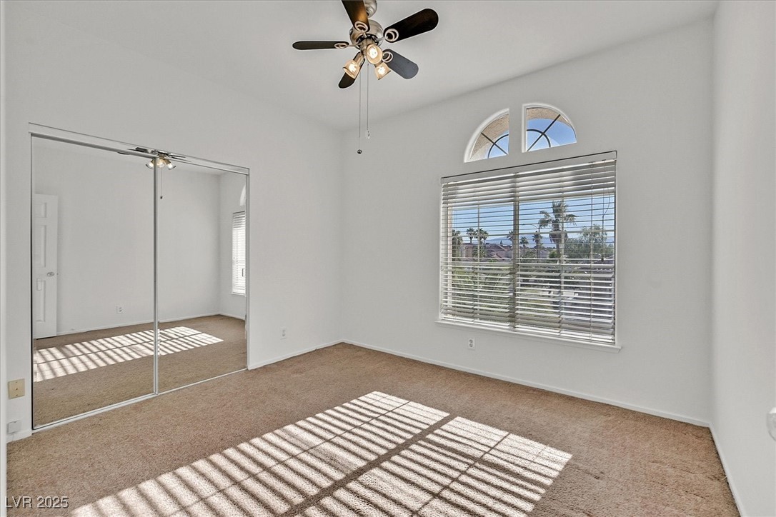 234 Highgate Street Henderson, NV 89074 - Photo 17 of 22 Unfurnished bedroom with carpet, a closet, and ceiling fan