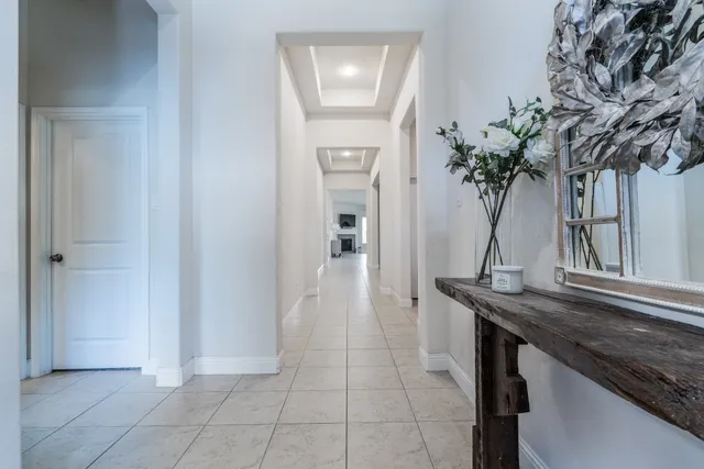 a view of entryway with a potted plant and a mirror