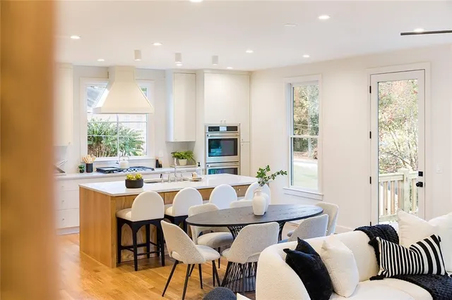 a view of a dining room with furniture and window