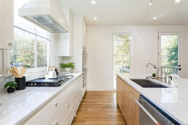 a large kitchen with a large window