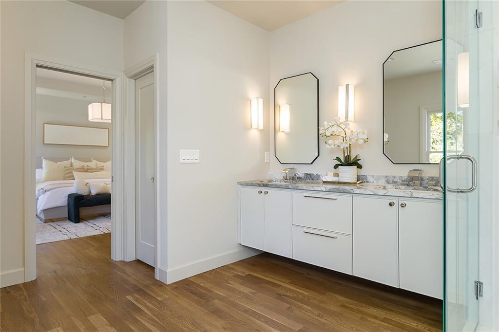 3156 Zion Street Scottdale, GA 30079 - Photo 25 of 48 a en suite bathroom with a granite countertop sink and a mirror