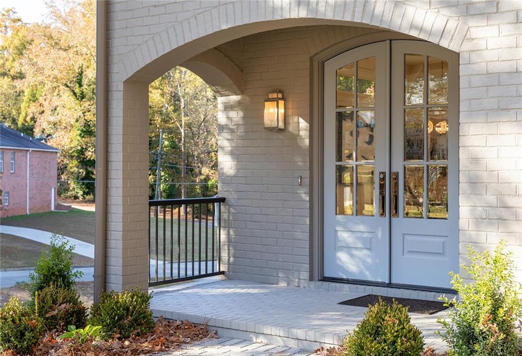 3156 Zion Street Scottdale, GA 30079 - Photo 5 of 48 a view of a wooden door with a small garden