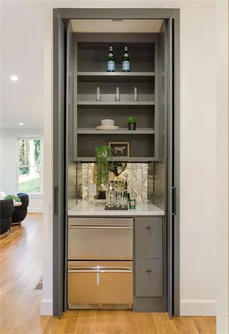 a kitchen with a refrigerator and cabinets