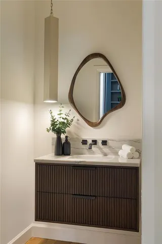 a bathroom with a sink and a mirror