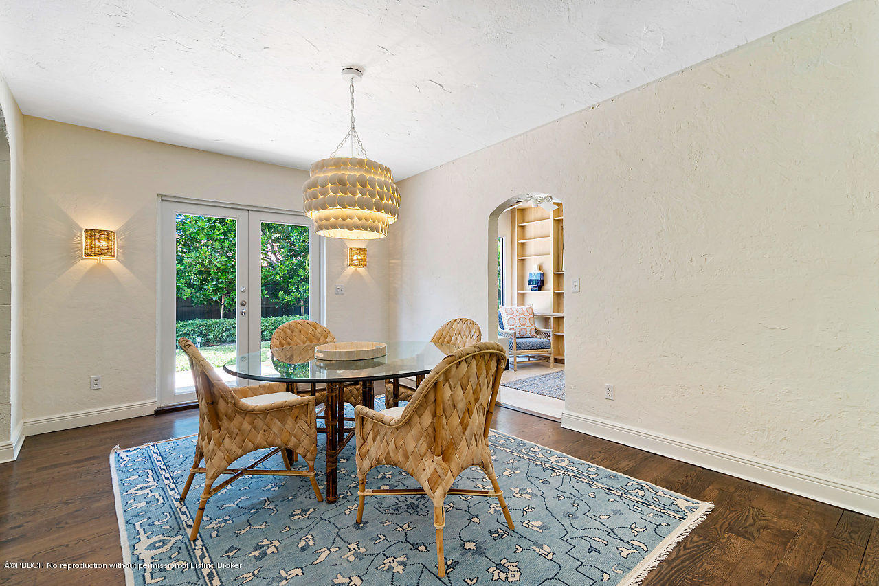 231 Dyer Road West Palm Beach, FL 33405 - Photo 11 of 45 a dining room with furniture a chandelier and wooden floor