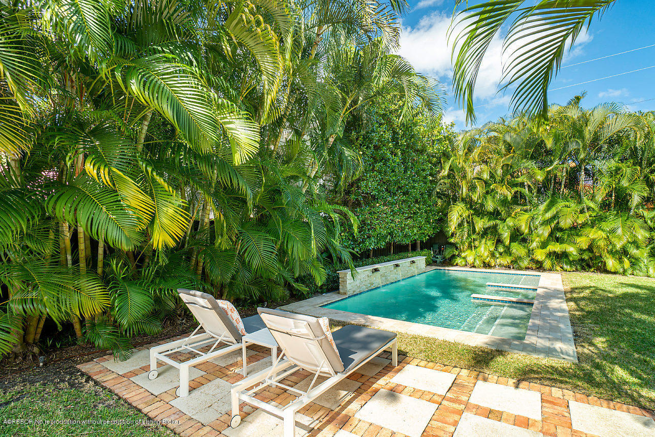 231 Dyer Road West Palm Beach, FL 33405 - Photo 21 of 45 a view of swimming pool with lawn chairs and plants