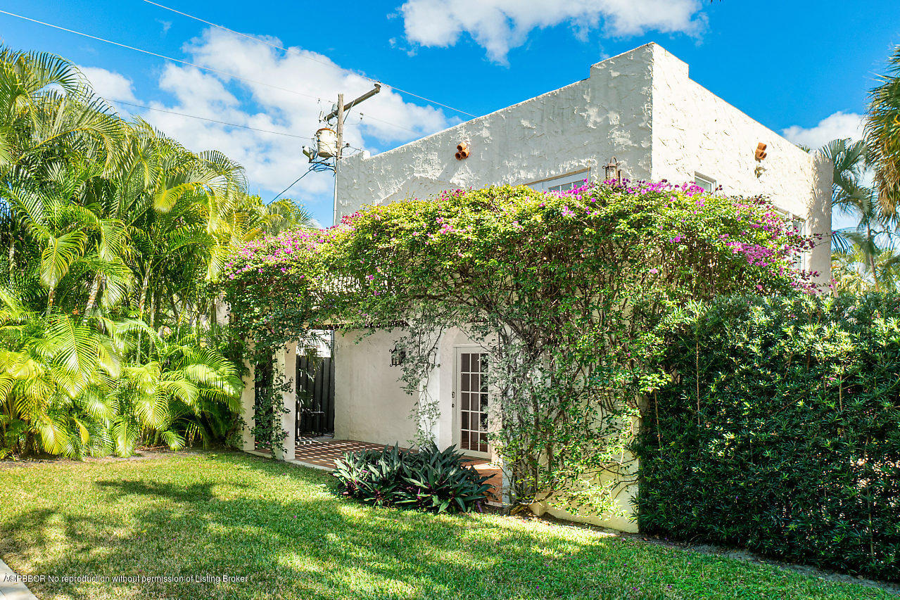 231 Dyer Road West Palm Beach, FL 33405 - Photo 22 of 45 a view of a house with a yard and garden