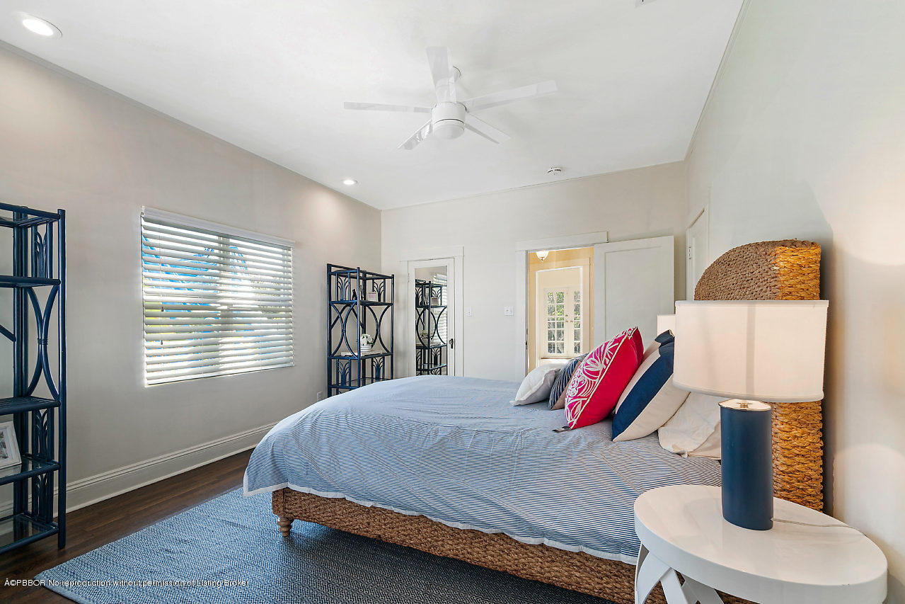 231 Dyer Road West Palm Beach, FL 33405 - Photo 23 of 45 a bed sitting in a bedroom next to a window