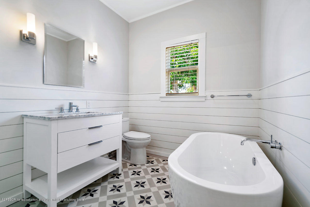 231 Dyer Road West Palm Beach, FL 33405 - Photo 29 of 45 a bathroom with a sink a toilet and a bathtub
