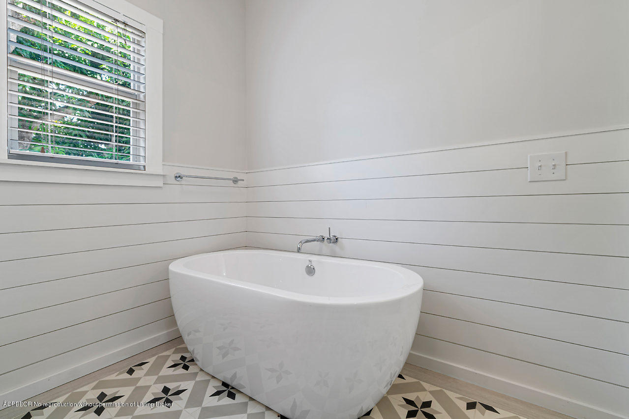 231 Dyer Road West Palm Beach, FL 33405 - Photo 30 of 45 a white bath tub sitting in a bathroom