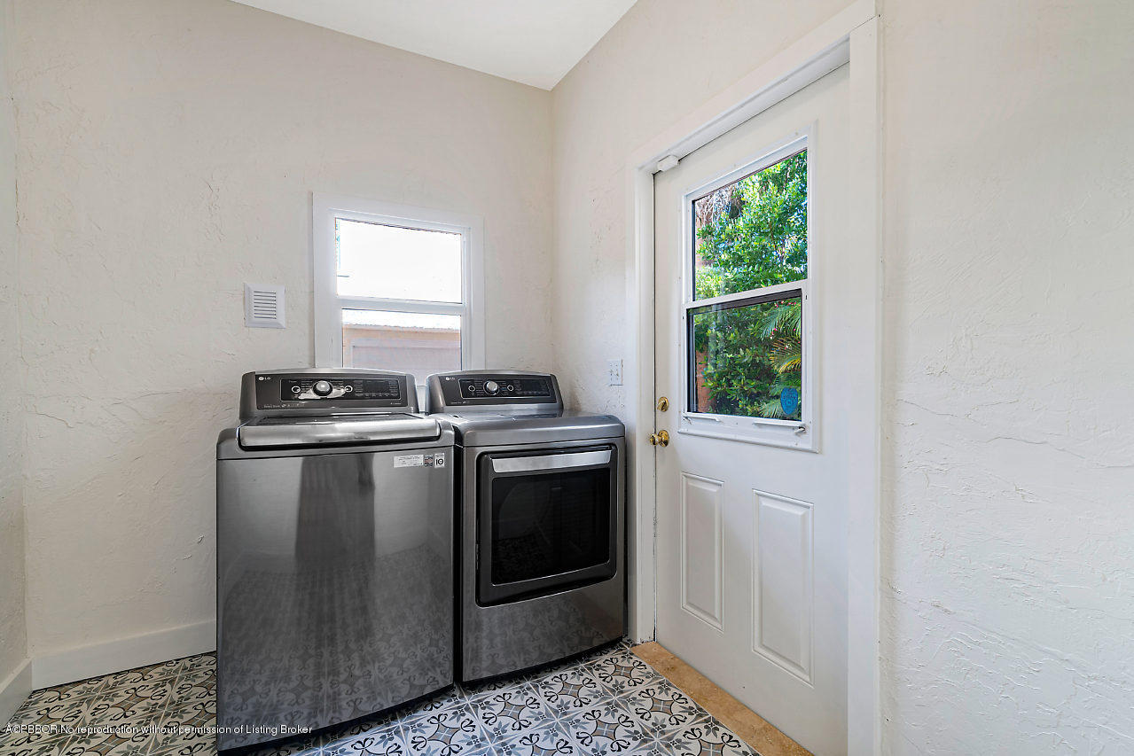 231 Dyer Road West Palm Beach, FL 33405 - Photo 32 of 45 a view of a kitchen with washer and dryer