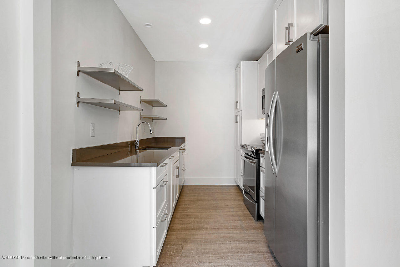 231 Dyer Road West Palm Beach, FL 33405 - Photo 35 of 45 a kitchen with stainless steel appliances a refrigerator and a stove