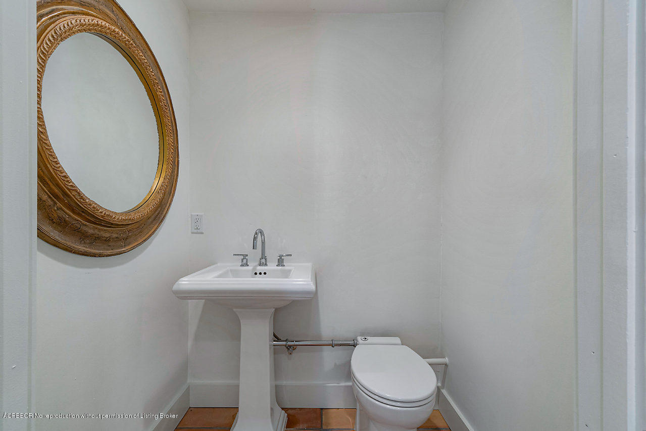 231 Dyer Road West Palm Beach, FL 33405 - Photo 43 of 45 a bathroom with a sink a toilet and a mirror